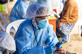 Image of Medicares medical volunteer working at an aid site.